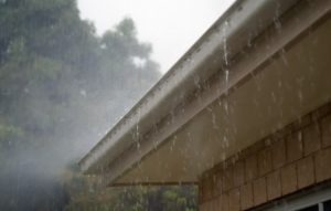 rain overflowing gutters